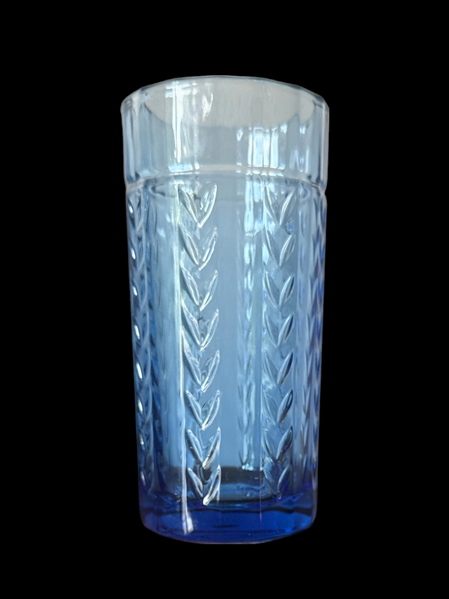 Actual Product Image - Clear glass tumbler with blue base and geometric pattern on a black background