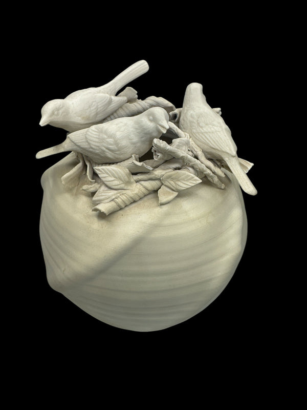 Actual Product Image - White ceramic sculpture of birds on a branch with leaves on a black background 