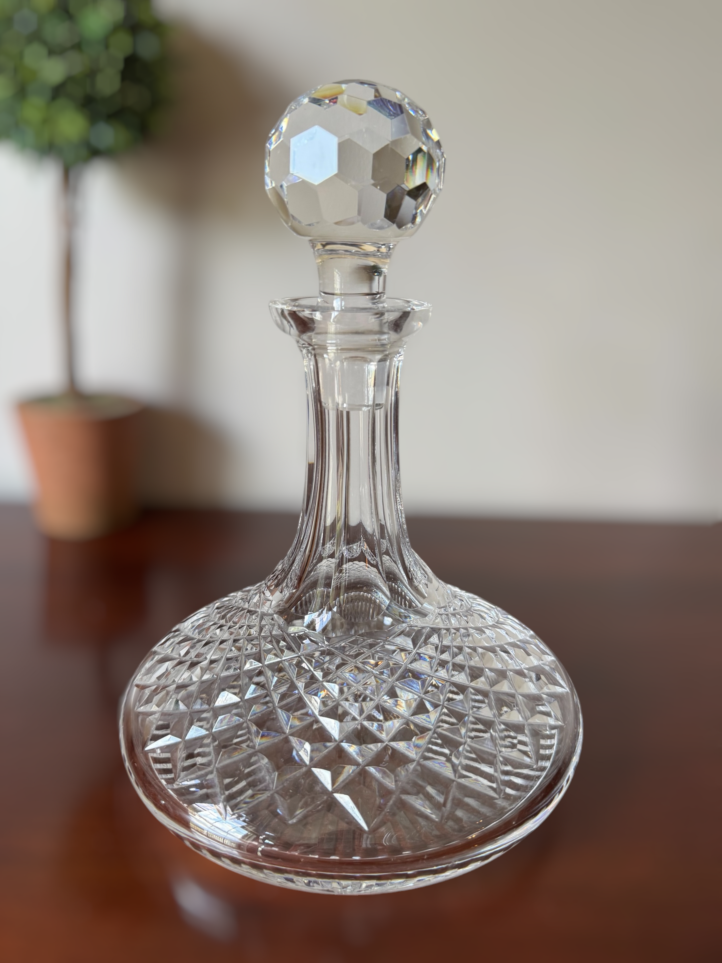 Actual Product Image - Clear glass decanter with diamond cut design on a wooden surface