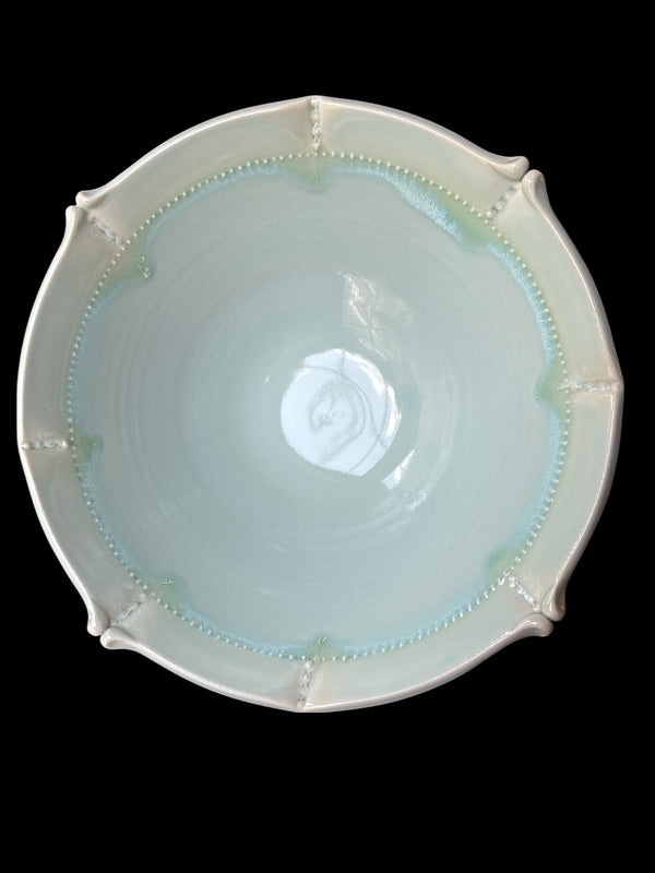 Actual Product Image - Ceramic bowl with decorative rim on a black background