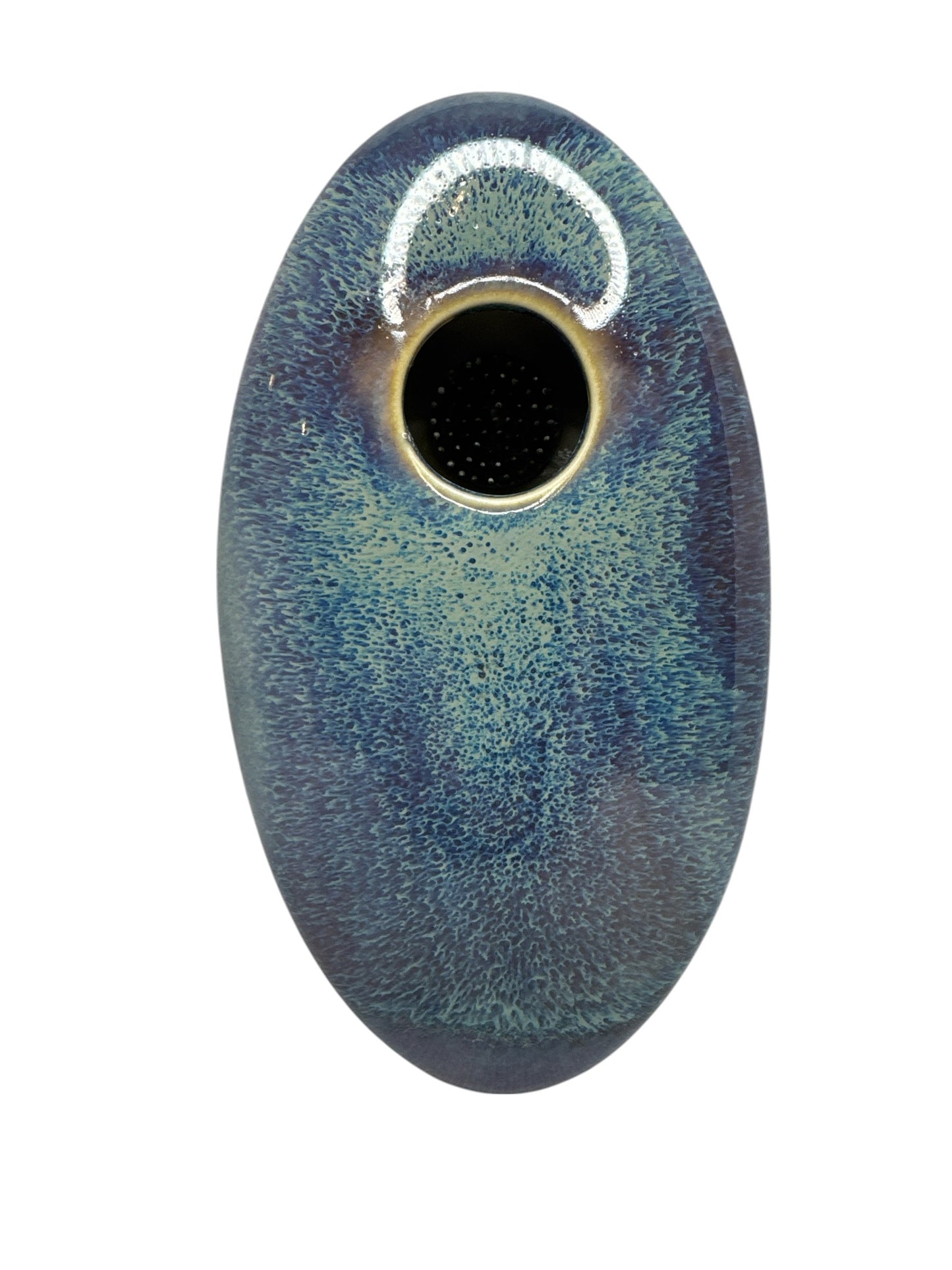 Actual Product Image - Oval ceramic object with textured surface and central hole on a white background