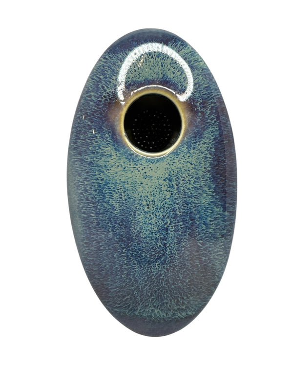 Actual Product Image - Oval ceramic object with textured surface and central hole on a white background