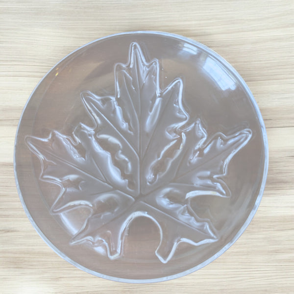 Actual Product Image - Clear plastic mold with a leaf design on a wooden surface