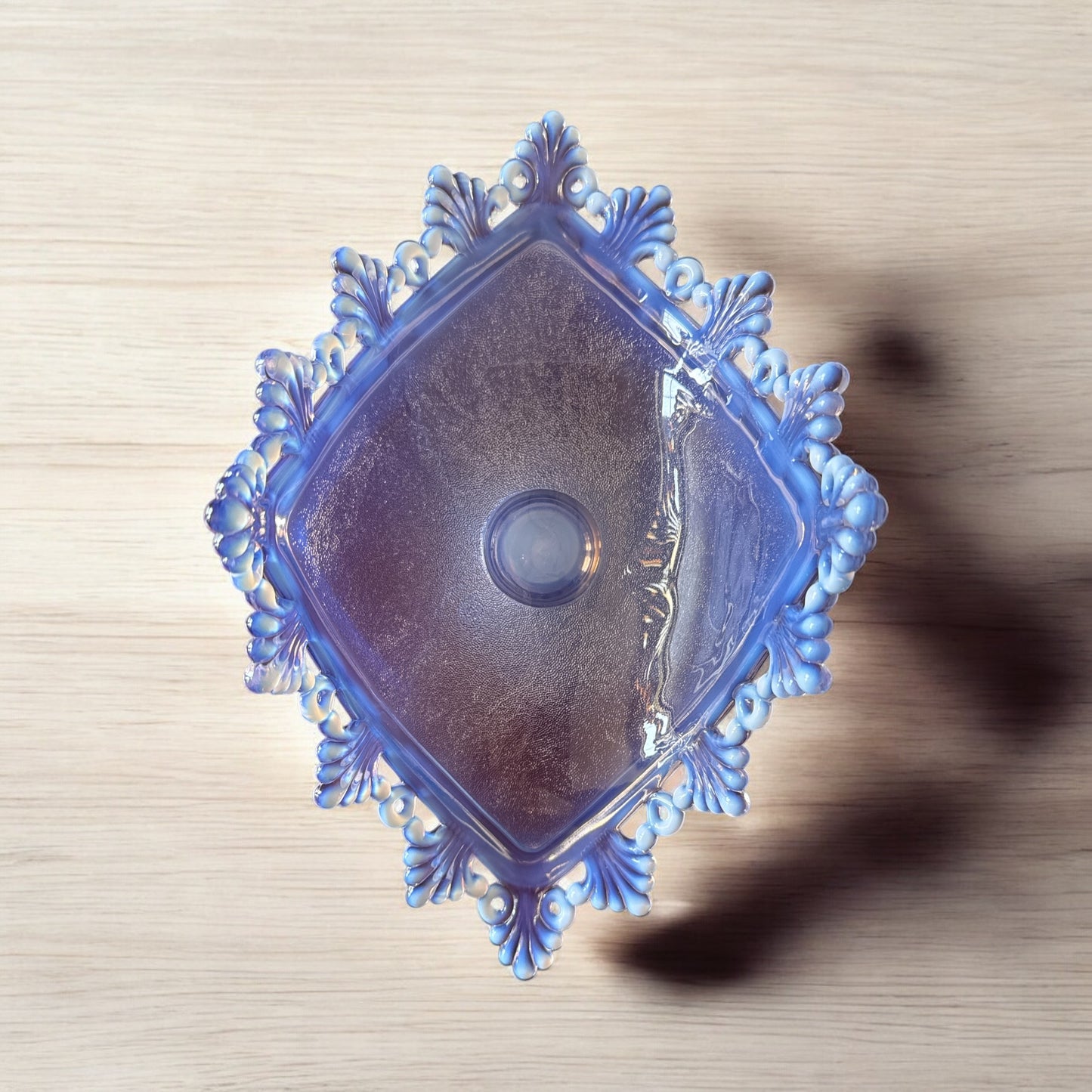Actual Product Image - Decorative blue glass dish on a wooden surface