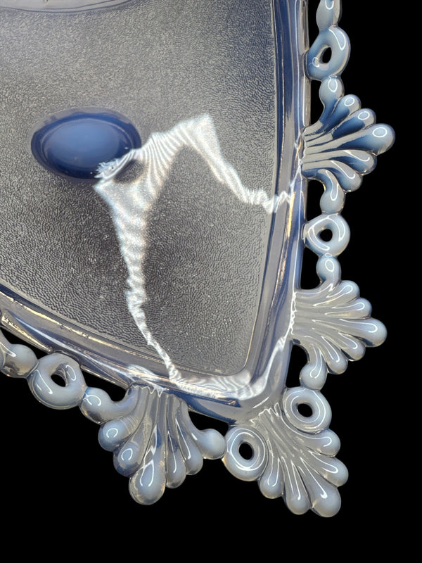 Actual Product Image - Decorative glass dish with blue center and silver rim on a black background